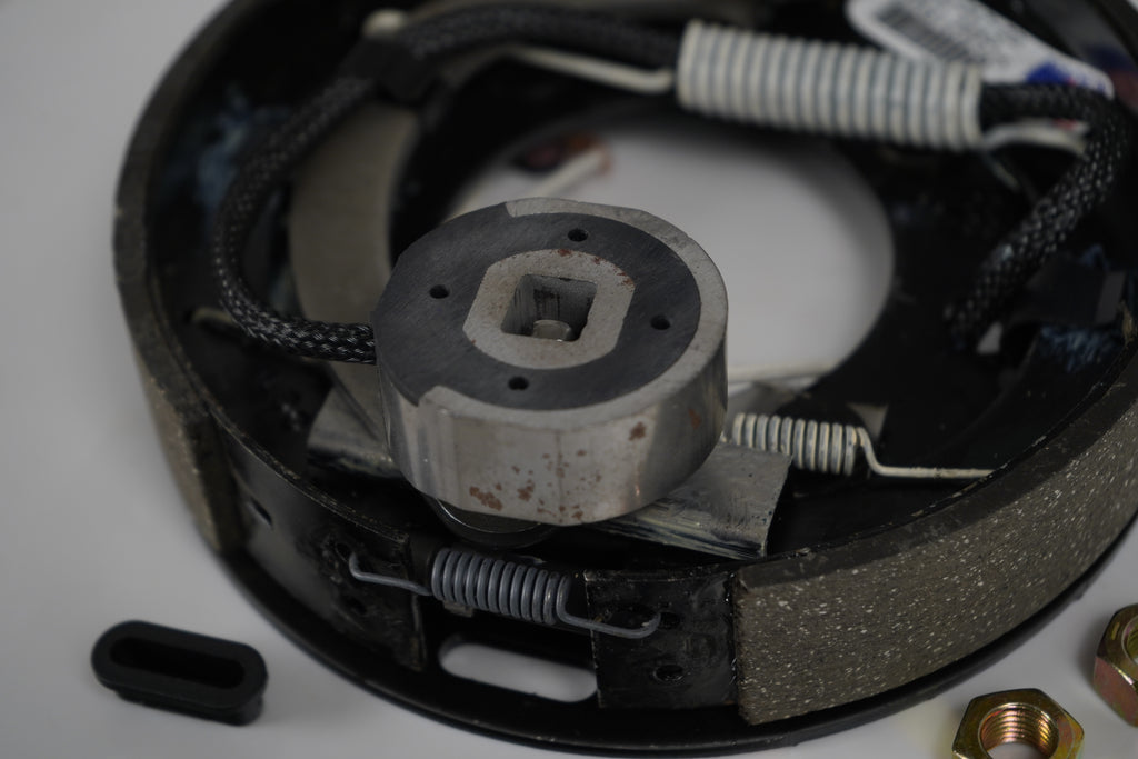 One-  Genuine Dexter  7 x 1-1/4" Electric Brake Assembly One Left Side Only (023-047-00)