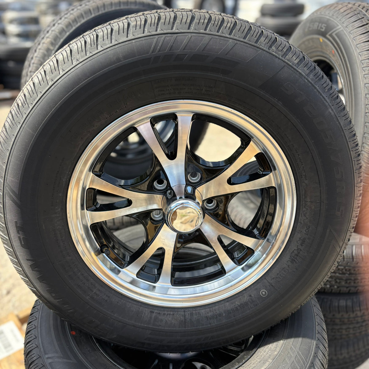 ST225/75R15 Load Range E Radial Trailer Tire and White Steel Spoke Wheel Assembly (915-545-137)